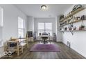 Well-lit home office with natural light, custom shelves, laminate floors and ample workspace at 4078 Omaha Dr, Bargersville, IN 46106