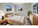 Serene main bedroom with ample light, soft rug, stylish furnishings, and modern accents at 415 W Gimber St, Indianapolis, IN 46225