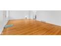 Spacious living room with hardwood floors, fresh paint, and ample natural light at 488 N 24Th Ave, Beech Grove, IN 46107