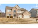 Charming two-story home with brick facade, two-car garage, and well-maintained lawn at 5344 Misthaven Ln, Greenwood, IN 46143