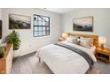 Cozy bedroom featuring natural light, neutral decor, and minimalist furnishings at 5721 Rosemont Ct, Indianapolis, IN 46254