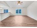 Spacious living room featuring hardwood floors, and a large window at 5721 Rosemont Ct, Indianapolis, IN 46254