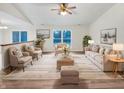Bright and airy living room with a ceiling fan, and large windows at 5721 Rosemont Ct, Indianapolis, IN 46254