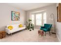 Bright living room with a bay window, comfortable seating and stylish accents, offering a cozy and inviting atmosphere at 5769 Marsh Glen Ct, Carmel, IN 46033