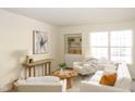 Bright living room showcasing stylish furnishings, a built-in shelf, and lots of natural light at 6014 Wildcat Dr, Indianapolis, IN 46203
