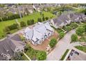 Stunning aerial view of a new home under construction in a well-planned community near a pond and green spaces at 6673 Beekman Pl # Ste A, Zionsville, IN 46077