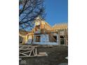 Framing stage of a new home under construction, showcasing the early structure and design at 6673 Beekman Pl # Ste A, Zionsville, IN 46077