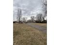 Two story home with brick and siding, dormer windows and brown shutters on a large lot at 6797 W 900 N, McCordsville, IN 46055