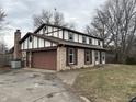 Two story home with brick and siding, dormer windows, attached garage and brown shutters at 6797 W 900 N, McCordsville, IN 46055