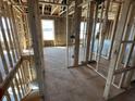 Unfinished staircase with wooden framing, leading to the second floor, showcasing the home's layout at 764 Oakleaf Dr, Greenfield, IN 46140