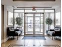 Welcoming lobby area with comfortable seating, elegant decor, and views to the street at 802 N Meridian St # 205, Indianapolis, IN 46204