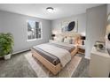 Bright bedroom with a decorative rug, neutral color palette, and ample natural light at 9435 Timber View Dr, Indianapolis, IN 46250