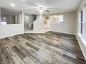 Open floor plan featuring hardwood flooring in living area, offering a seamless transition to the kitchen at 976 Peppermint Ct, Greenfield, IN 46140