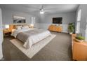 Cozy main bedroom with neutral tones, wood accents, and soft lighting for a relaxing atmosphere at 9924 Boysenberry Dr, Fishers, IN 46038