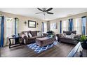 Comfortable living room with stylish furniture, including a plush sofa, and large windows, creating a cozy atmosphere at 11430 Congaree Way, Indianapolis, IN 46235
