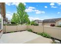 Back patio area featuring a privacy fence and concrete pad at 13902 Rue Royale Ln # 62, McCordsville, IN 46055
