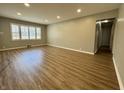 Bright living room with hardwood floors, recessed lighting, and a large window at 1725 E 110Th St, Carmel, IN 46280
