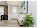 Bright entryway with elegant decor, a bench, and a view of the front door at 203 Chatham Bend Dr, Westfield, IN 46074