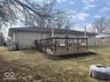Backyard featuring a spacious deck with outdoor seating, perfect for entertaining and relaxing at 2104 W Barcelona Dr, Muncie, IN 47304
