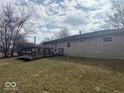 Expansive backyard with a wooden deck, ideal for outdoor living and gatherings at 2104 W Barcelona Dr, Muncie, IN 47304