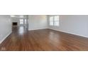 An open living room showcases wood flooring and natural light at 3113 Cassara Dr, Indianapolis, IN 46203