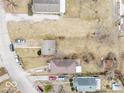 Overhead view of a single-story home with neighboring houses and roads at 3145 Stuart St, Indianapolis, IN 46218