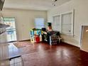 Spacious living room with hardwood floors, bright windows, and plenty of room for entertaining at 3613 Schofield Ave, Indianapolis, IN 46218