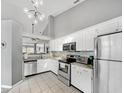 Modern kitchen featuring stainless steel appliances, and stylish light fixture at 3708 Magenta Ln # 3, Indianapolis, IN 46214