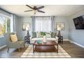 Inviting living room featuring a comfortable sofa, stylish armchair, and ample natural light at 4559 Bonnie Brae St, Indianapolis, IN 46228