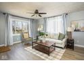 Bright living room with modern furnishings, large windows, and stylish decor at 4559 Bonnie Brae St, Indianapolis, IN 46228