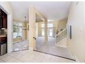 Spacious foyer with tile floors, leading to a bright and open living area at 4615 Crystal Lake Dr, Indianapolis, IN 46240