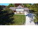 Stunning aerial view of the property, highlighting the lush greenery and landscape at 5704 Springhollow Ct, Avon, IN 46123
