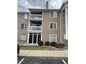 Exterior view showcasing a private balcony and a partially brick facade, enhancing outdoor living at 6526 Jade Stream Ct # 309, Indianapolis, IN 46237