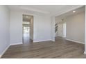 Spacious living room with durable floors, neutral walls, large windows, and ample natural light at 7181 Barrett Dr, Brownsburg, IN 46112