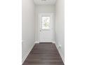 Inviting entryway showcasing wood-look flooring and a door with privacy blinds at 1231 Langham St, Avon, IN 46123