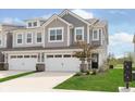 Charming two-story townhome with a well-manicured front lawn at 1231 Langham St, Avon, IN 46123