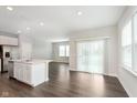 Bright open-concept kitchen featuring stainless steel appliances and a large island at 1231 Langham St, Avon, IN 46123