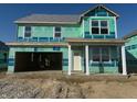 New two-story home featuring an attached two-car garage and covered porch awaiting personalization at 1358 Foxtail Ln, Greenwood, IN 46143