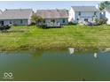 Expansive backyard featuring a deck and pond view, ideal for outdoor activities and enjoying nature at 14963 Mia Dr, Carmel, IN 46033