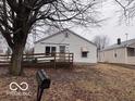 Charming single-story home featuring a wooden porch, a mailbox, and a well-maintained lawn at 1900 E Purdue Rd, Muncie, IN 47303
