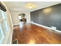 Spacious living room featuring hardwood floors and a neutral color palette at 24 N Clay St, Mooresville, IN 46158