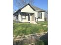 Charming single-story home with a covered front porch and well-maintained lawn at 2526 Eastern Ave, Indianapolis, IN 46218