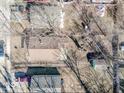 Overhead view of the property, featuring the home, garage, driveway, surrounding yard, and neighborhood layout at 3455 Hillside Ave, Indianapolis, IN 46218