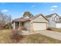 Charming single Gathering home with a two-car garage, small porch, and partial brick facade at 4704 Whitview Ln, Indianapolis, IN 46237