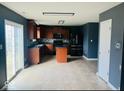 Modern kitchen featuring stainless steel appliances, center island, and sleek countertops, perfect for cooking at 476 Haywood Dr, Greenfield, IN 46140