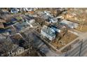 Aerial view showcasing a neighborhood with tree-lined streets and well-maintained homes at 5068 W 10Th St, Indianapolis, IN 46224