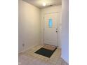 Clean entryway with a neutral palette and a door that has a stained glass window at 6896 Maywood Cir, Avon, IN 46123