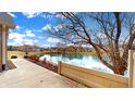 A picturesque view from the back of the property, showcasing a serene pond and well-maintained surroundings at 7914 King Post Dr, Indianapolis, IN 46237