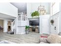Bright, open living room featuring a two story ceiling and modern furnishings at 9046 Glass Chimney Ln, Fishers, IN 46037