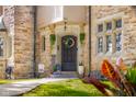 Inviting entryway with a decorative wreath and seasonal decor, enhancing the home's curb appeal at 906 Franklin St, Columbus, IN 47201